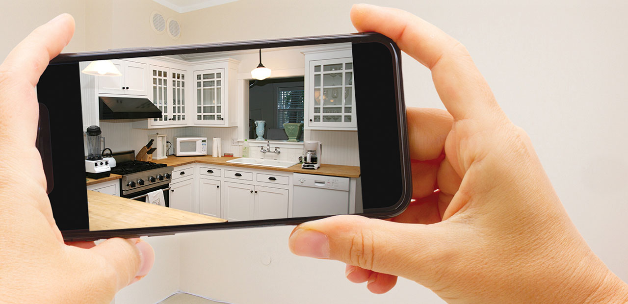 Taking a photo of a kitchen on cell phone