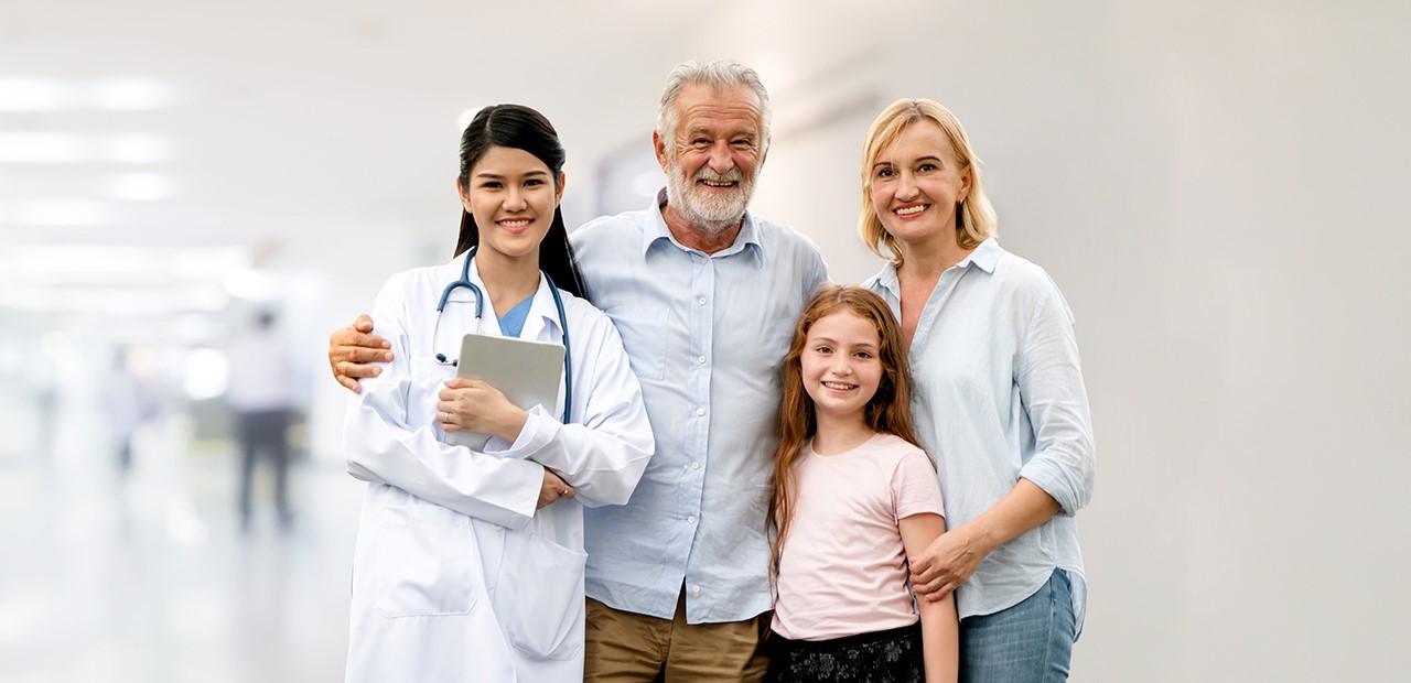 Doctor posing with a family