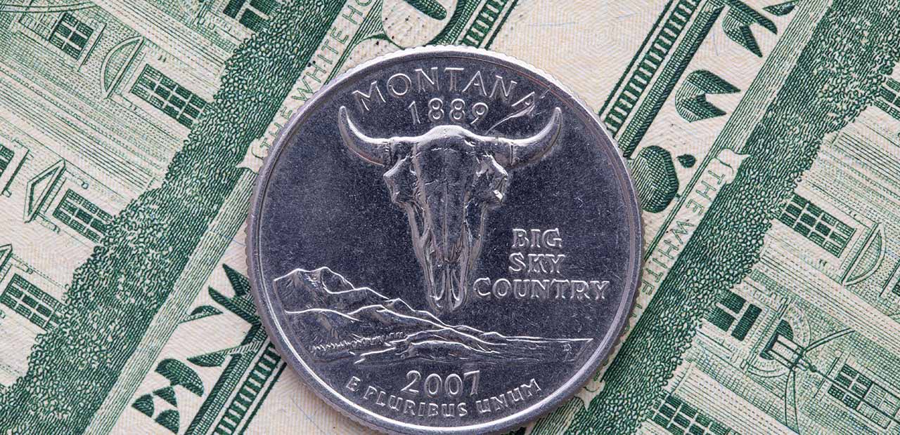 Montana quarter on top of $20 bills